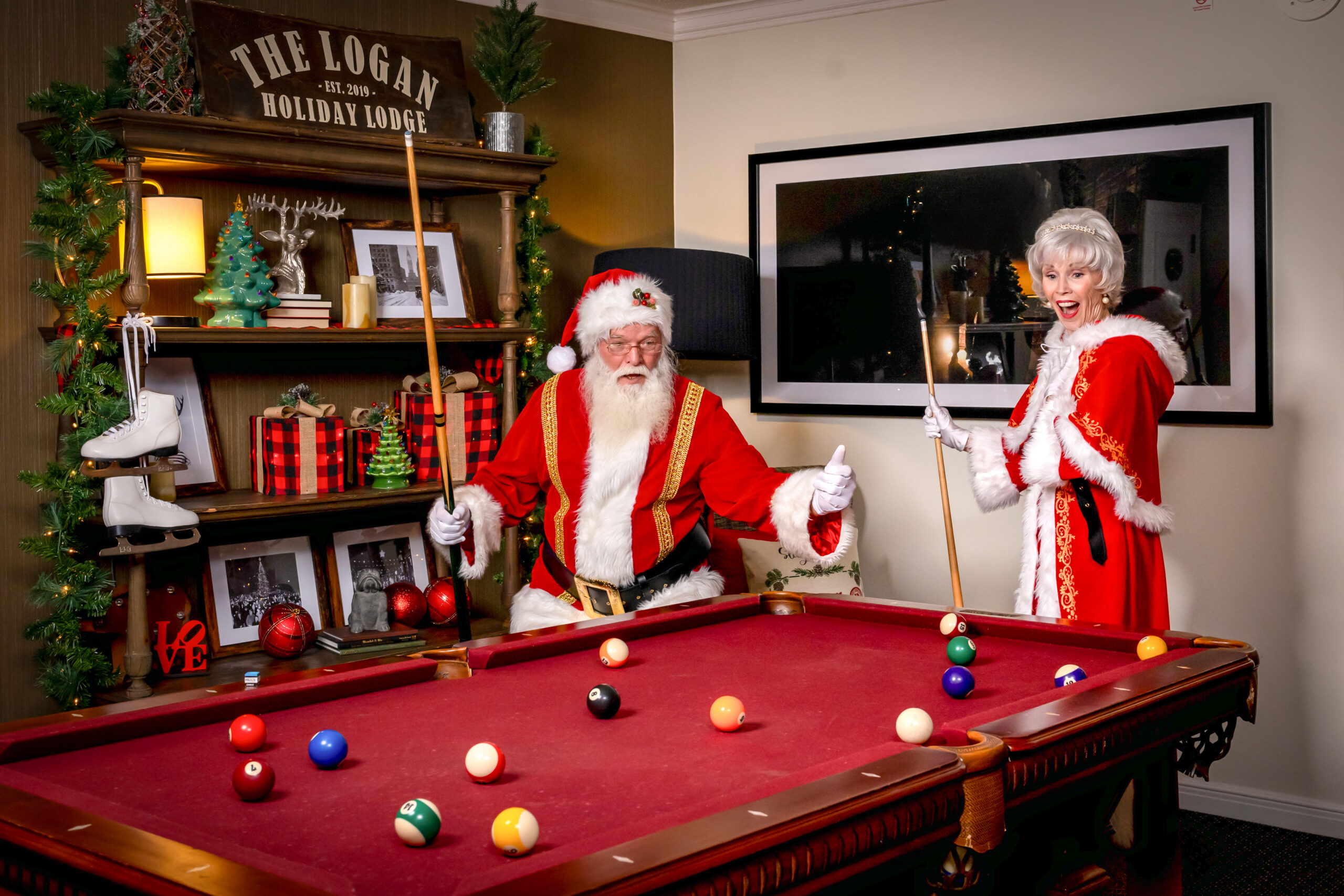Santa and Mrs. Claus at the pool table in the Holiday Lodge